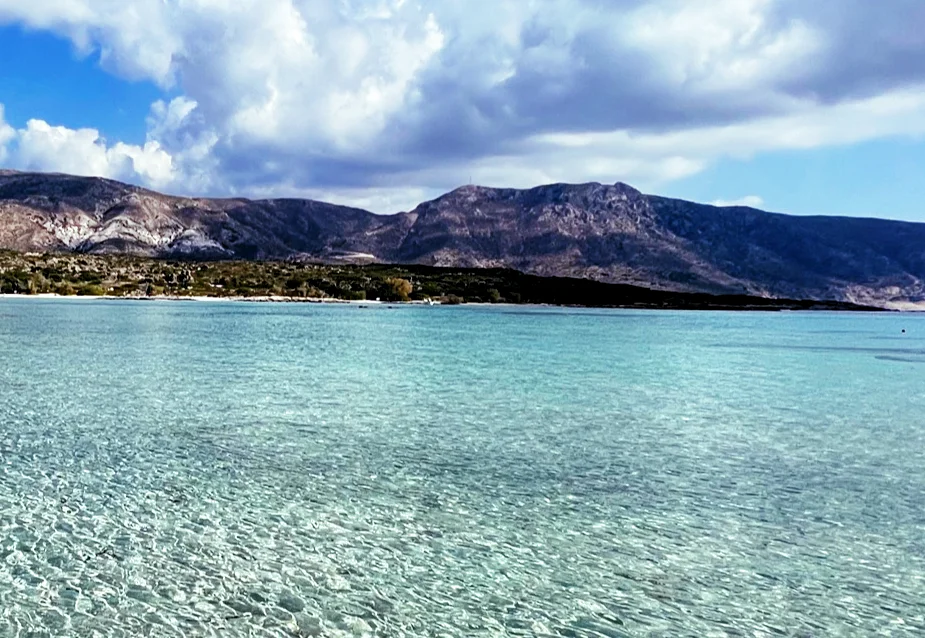 Crete Beaches, clear blue water with mountains in the background