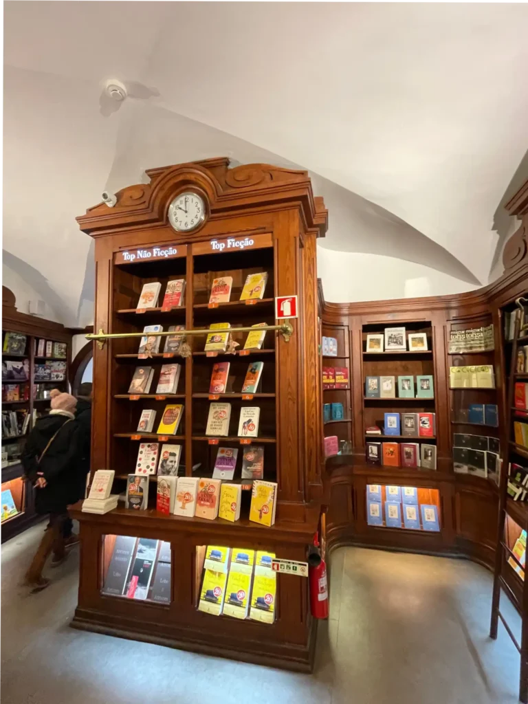 Livraria Bertrand, oldest bookstore in the world, image of interior with curved white ceiling and dark wood bookshelves