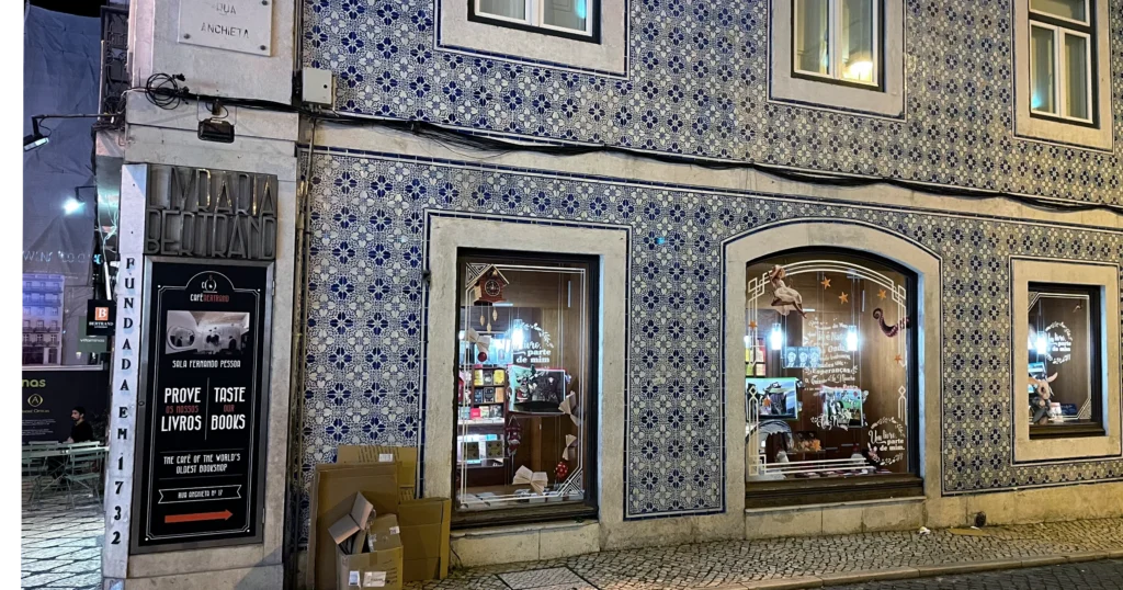Colorful Lisbon tile work, a building covered in blue and white tiles