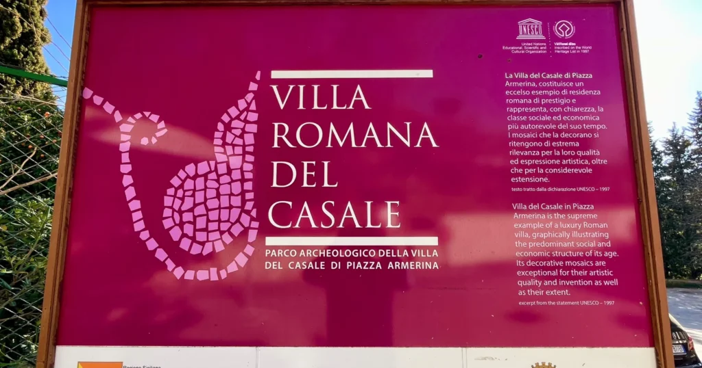 Maroon colored sign for the Villa Romano Del Casale in Sicily