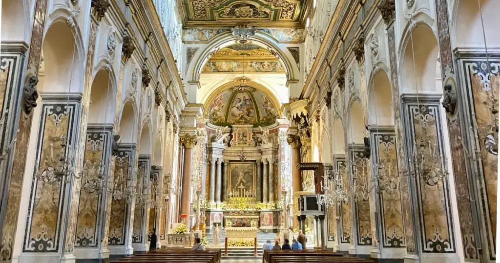 Interior of the Amalfi Cathedral with its ornate stone columns and ceiling