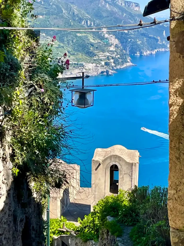 View of clear blue sea with store building in Amalfi