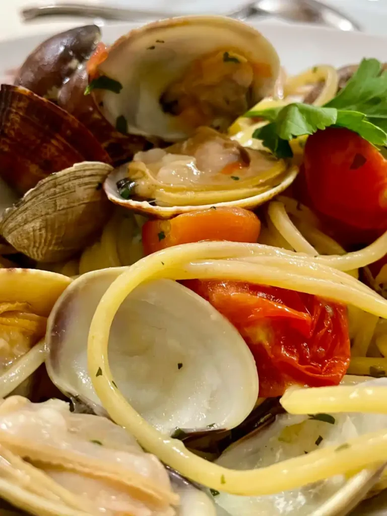 close up of clams, tomatoes and spaghetti