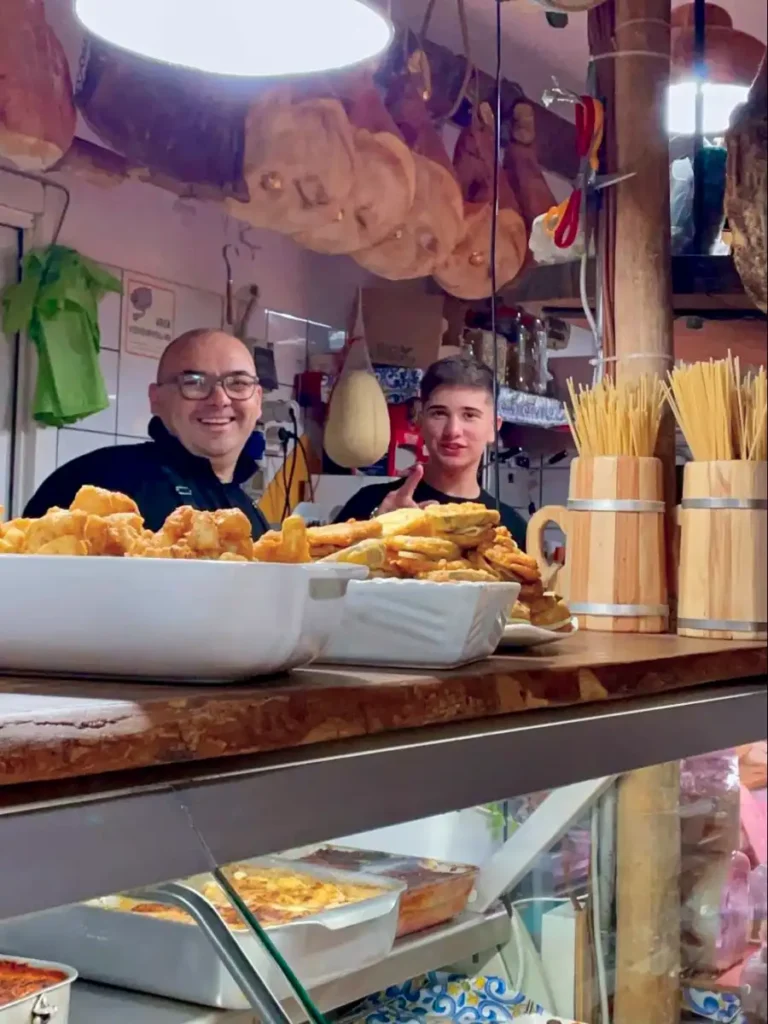 Employees behind the counter at La Cantinaccia del Popolo in Sorrento