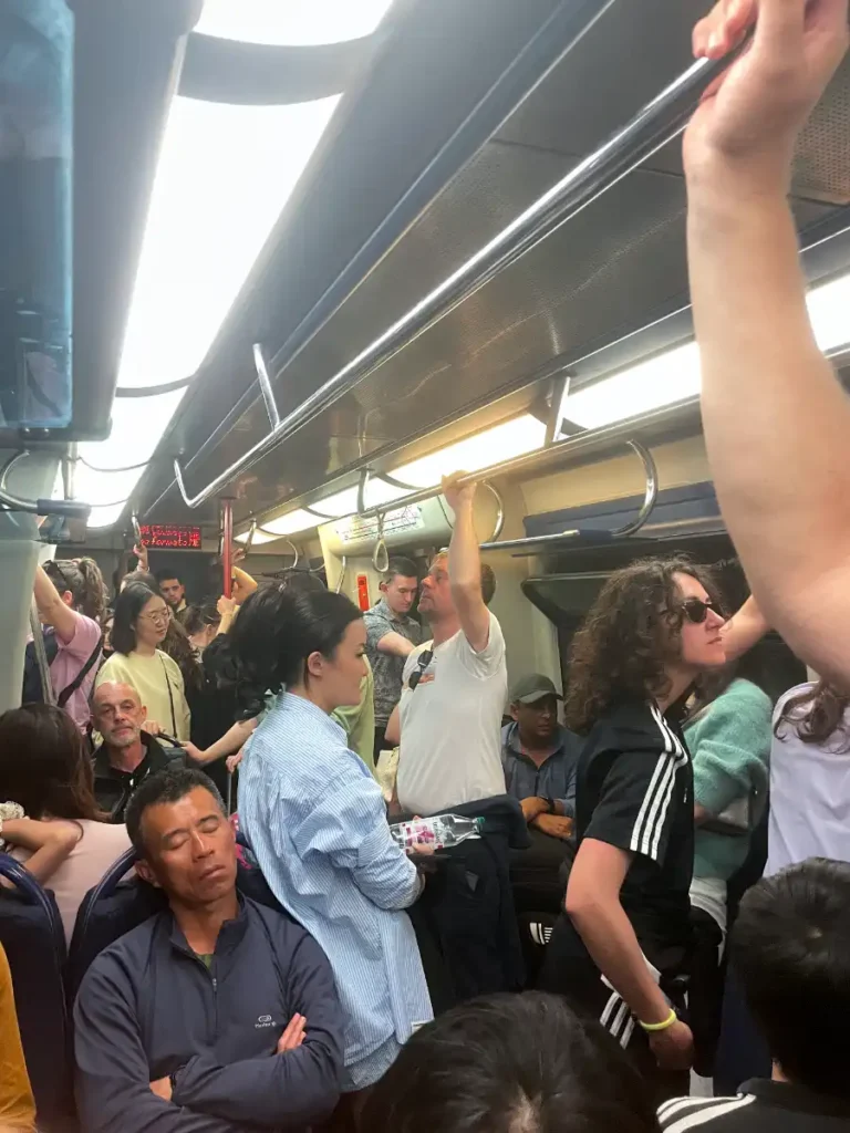 Inside view of a crowded Circumvisuvia Train on its way to Sorrento from Naples