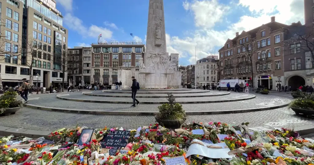 Amsterdam monument with flowers in the foreground