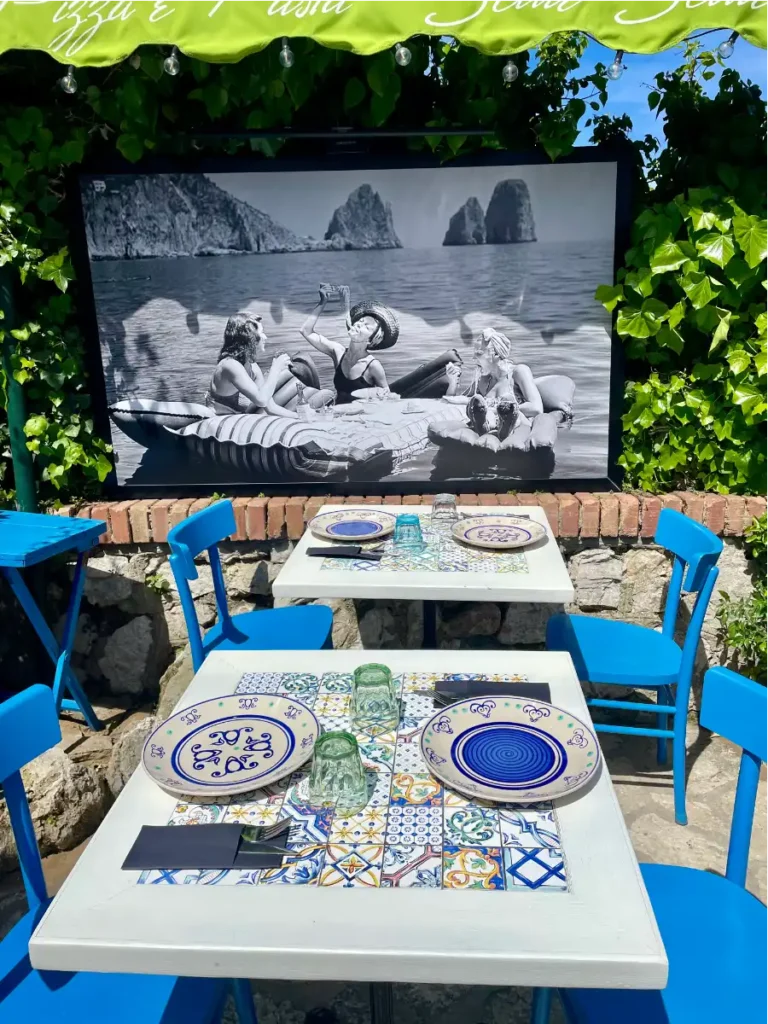 Blue table for four with bright green awning