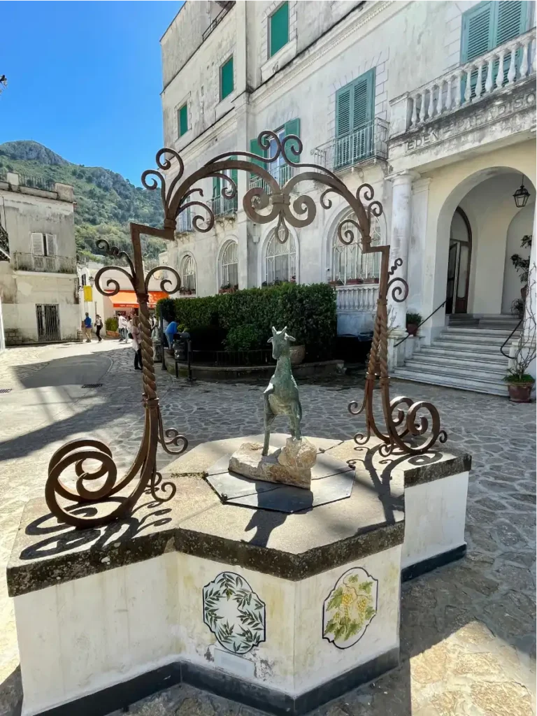 Courtyard with goat statue in the center in Capri