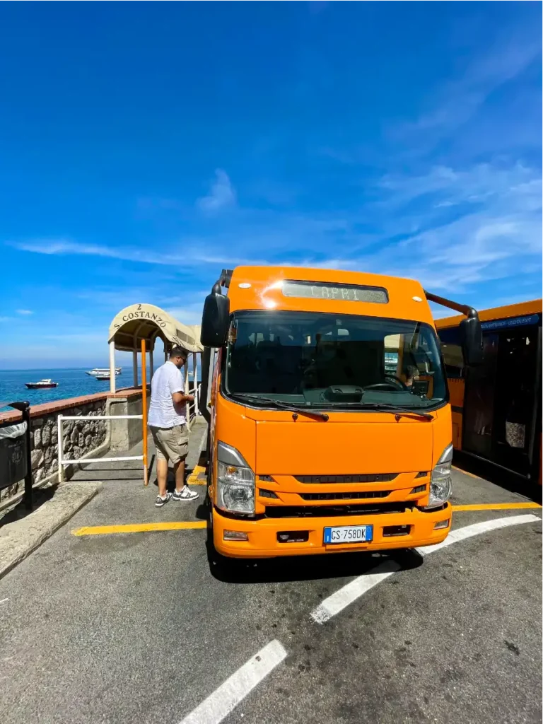 Front of orange bus heading to Capri town