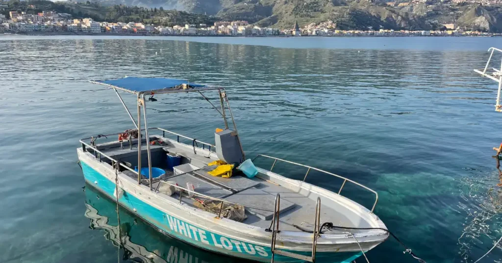 boat tour boat tied up to pier in Giardini Naxos