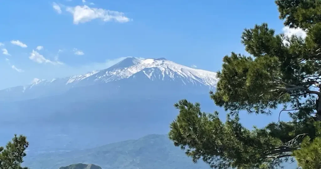 Taormina Sicily view of snow capped Mt Etna in the distance from Castelmola