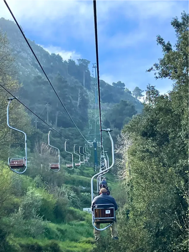 Riding up the Mt Solaro chairlift