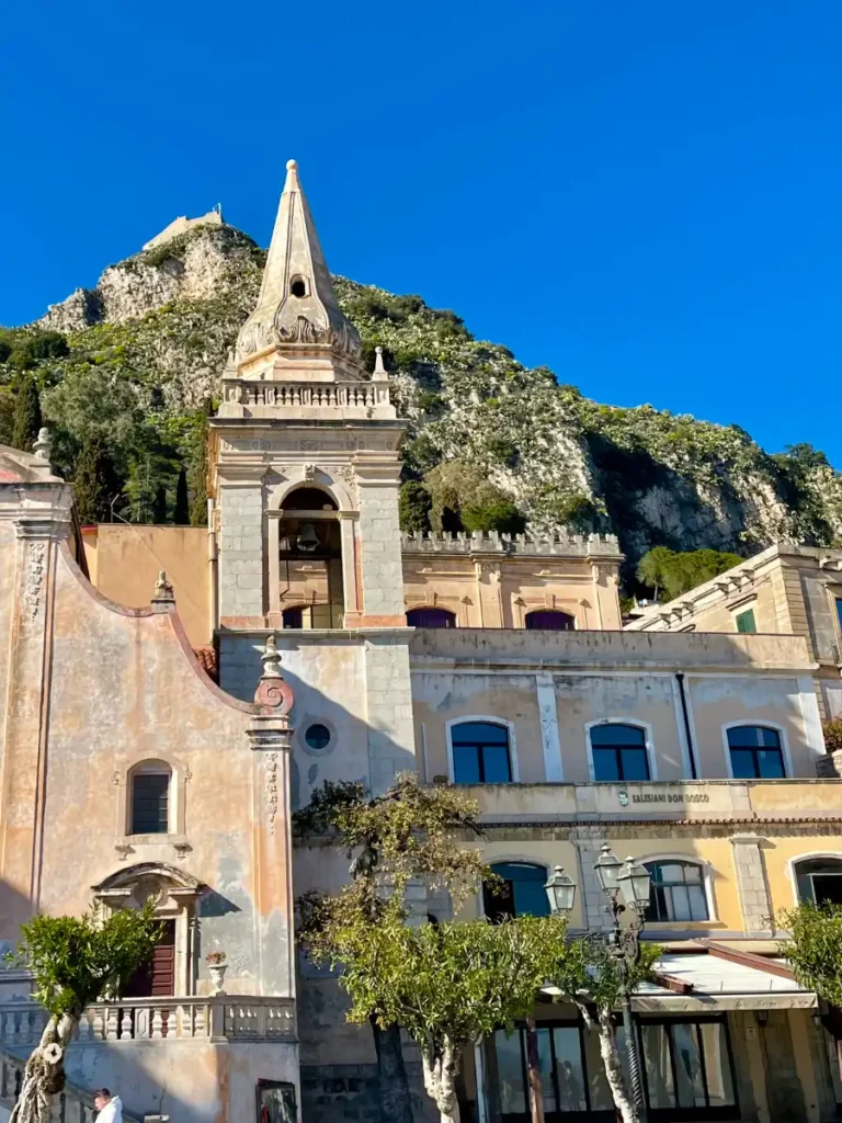 Taormina view looking up toward the church and castle above