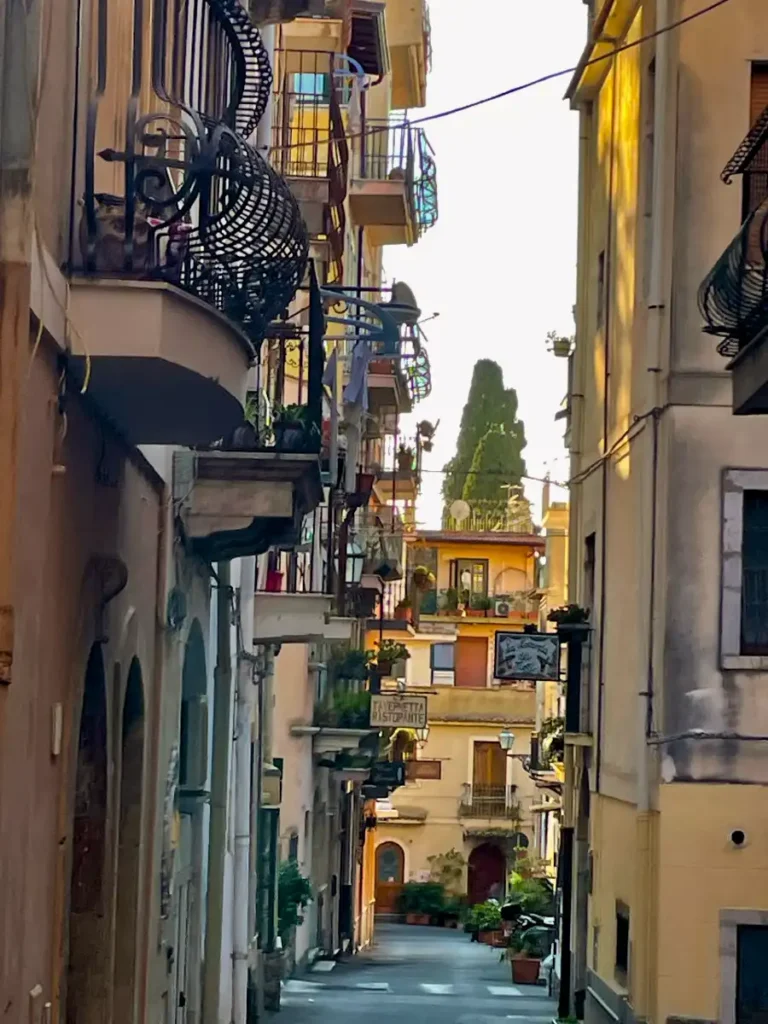 View of a balcony filled Taormina street