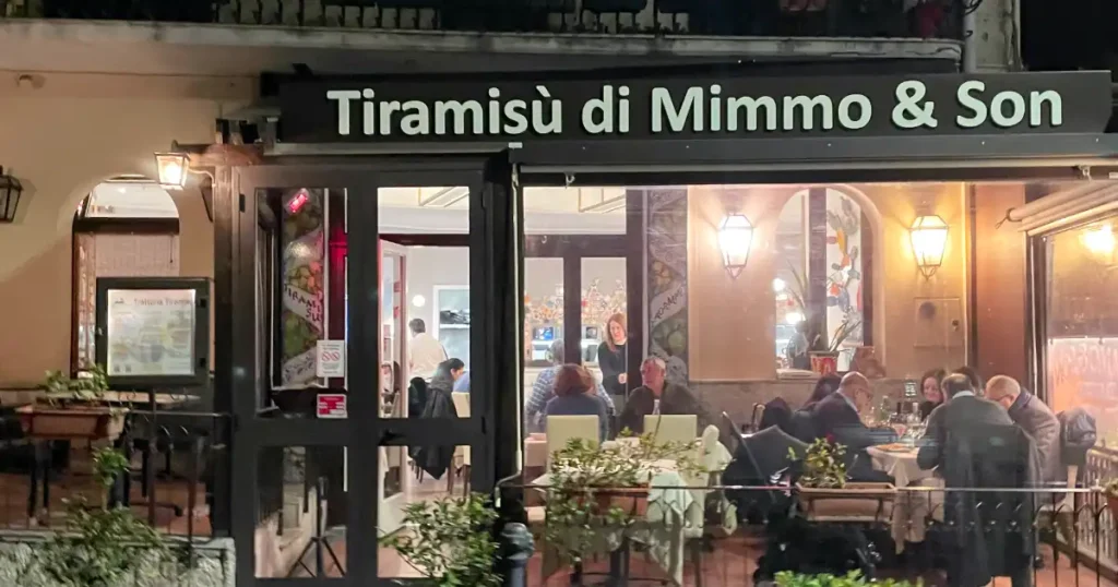 Trattoria Tiramasu di Mimmo and Sons front with black awning with white lettering