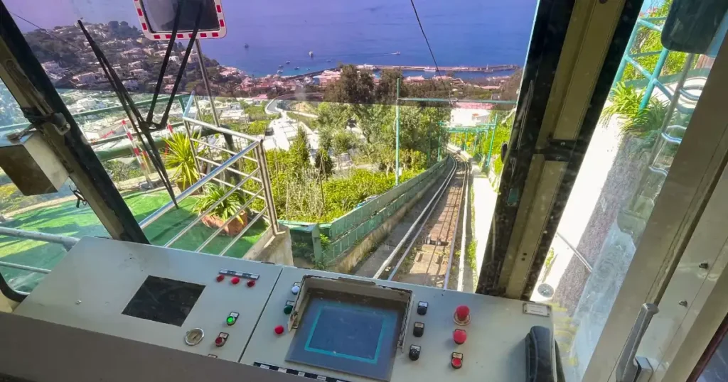 View out funicular window heading down to marina grande in capri