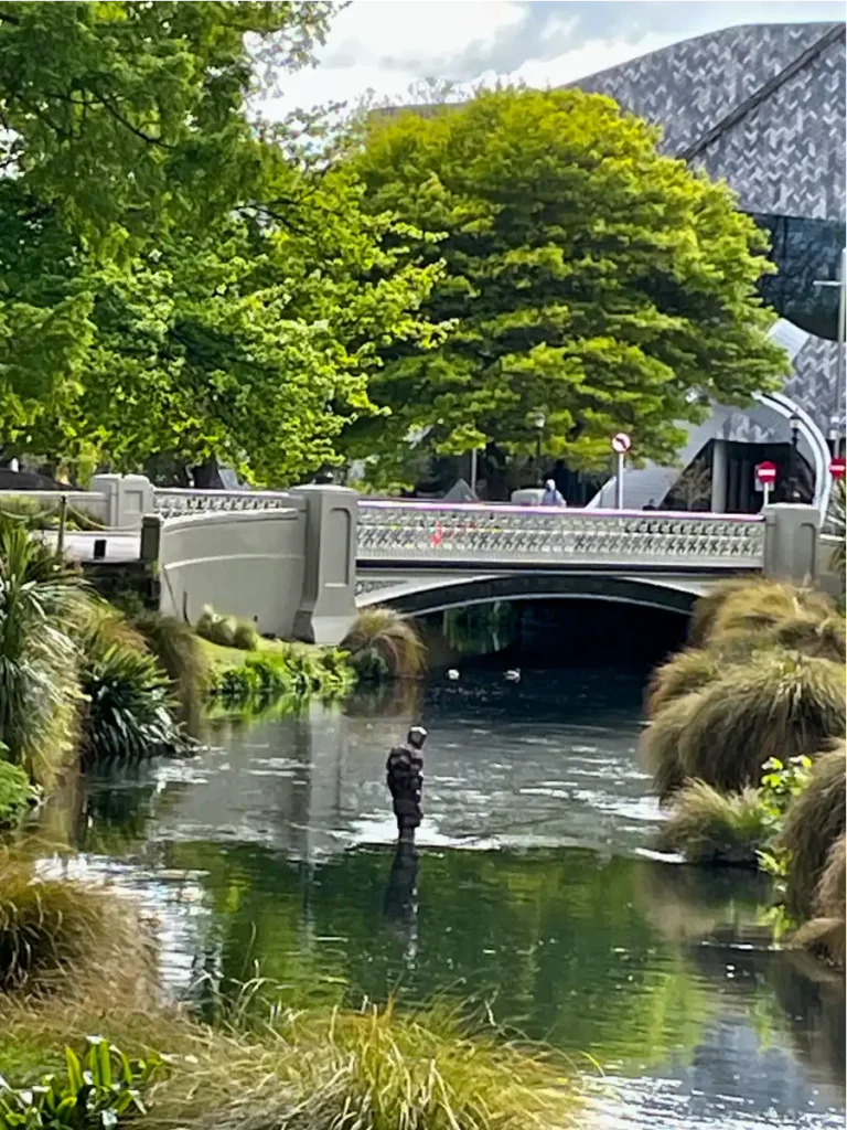 Christchurch New Zealand river with man fishing