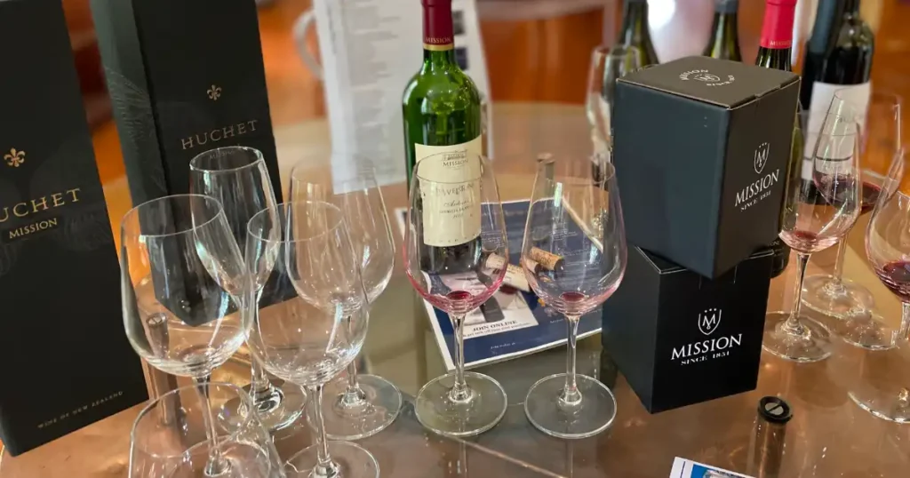 Red wine tasting glasses and bottle on a table