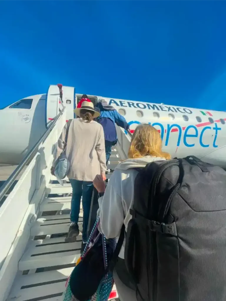 Boarding a plane via the stairs with Pacsafe backpack