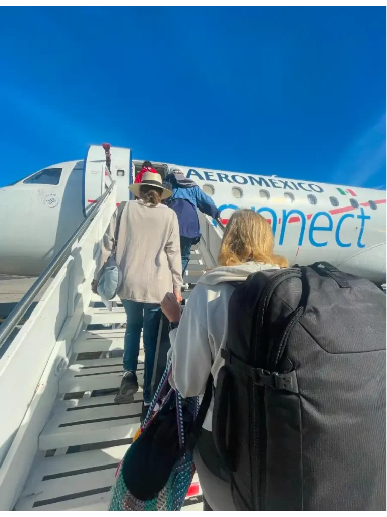 Boarding a plane via the stairs with Pacsafe backpack