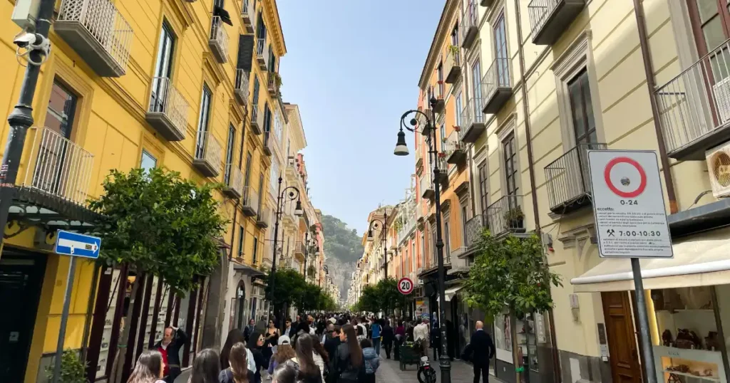 Slow Travel Amalfi Coast Busy Sorrento Street in Town with colored buildings