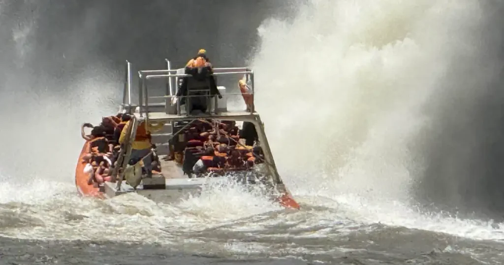 Inflatable boat heading into Iguazu Falls in Brazil