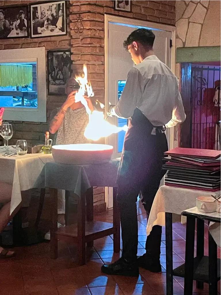 Preparation of Spaghettit in a Cheese Wheel a La Toscana in Puerto Iguazu