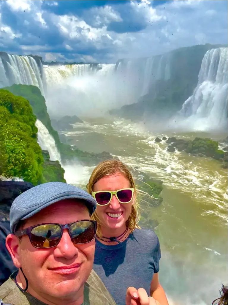 Selfie of Meghan and Dan with Devils Thoat inn Baground at end of day