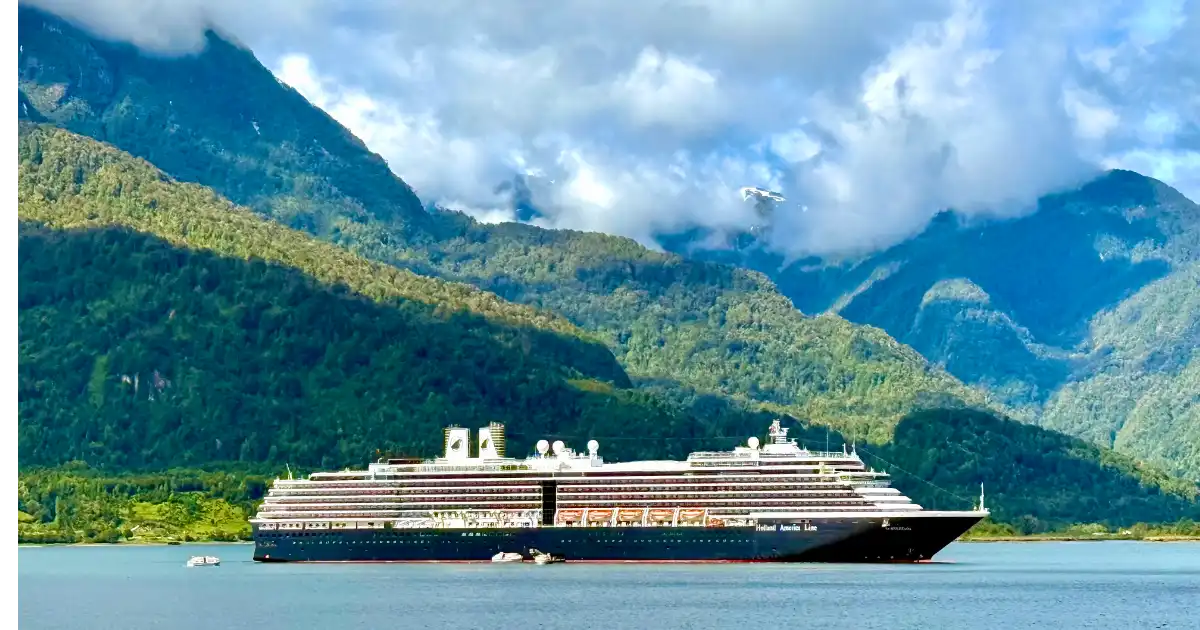 Holland America Oosterdam Antarctic Cruise Ultimate Port Guide Sitting in Chacabuco Harbor with Tenders and Mountain peaks