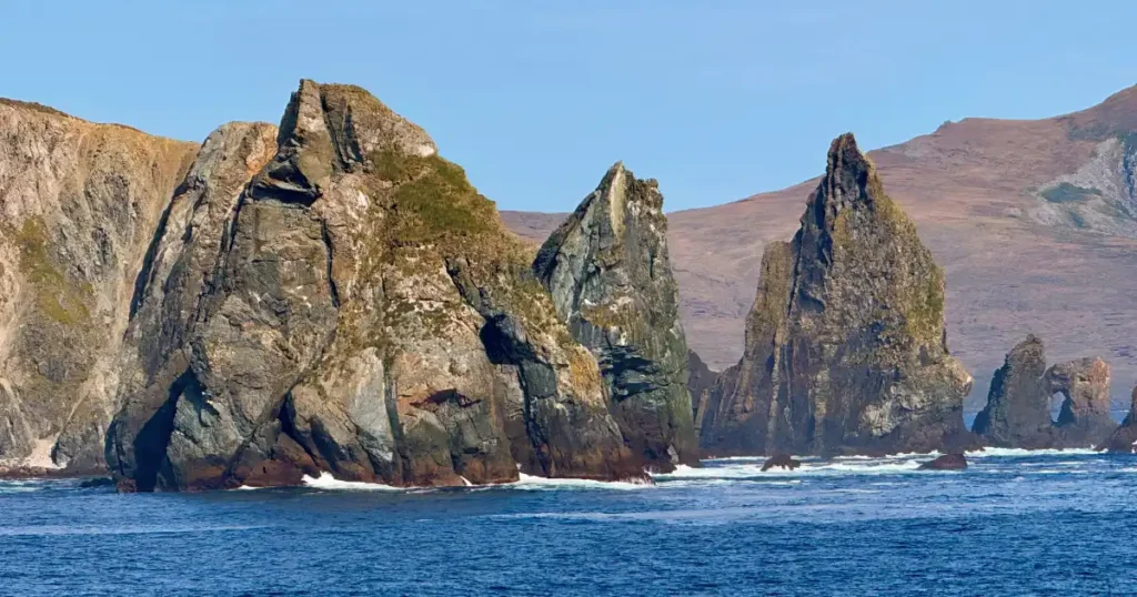 Jagged rock outcrop as we round Cape Horn South America with deep blue seas