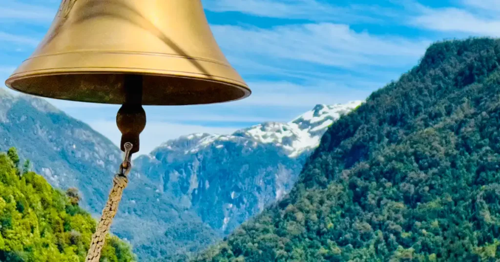 Puerto Chacabuco with Bell and View of Andes