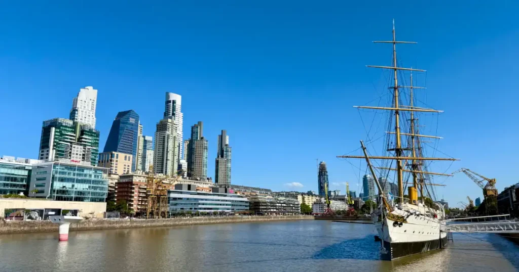 Puerto Modero image with modern buildings in the background and an antique ship on water